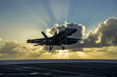 Arrested aircraft carrier crepuscular rays photo