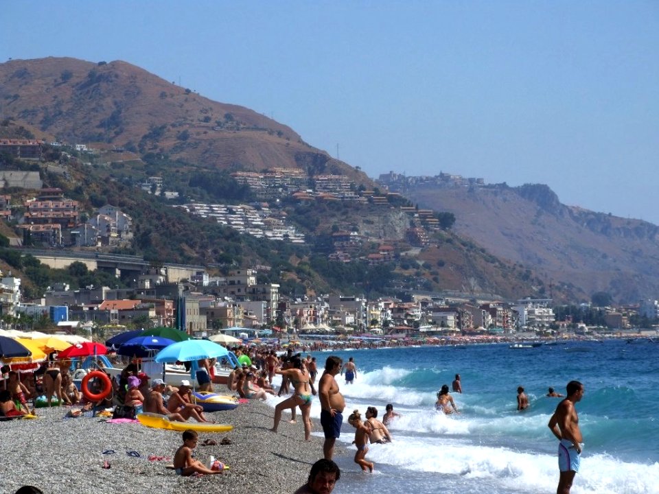 Italy-Taormina Beach - Creative Commons by gnuckx