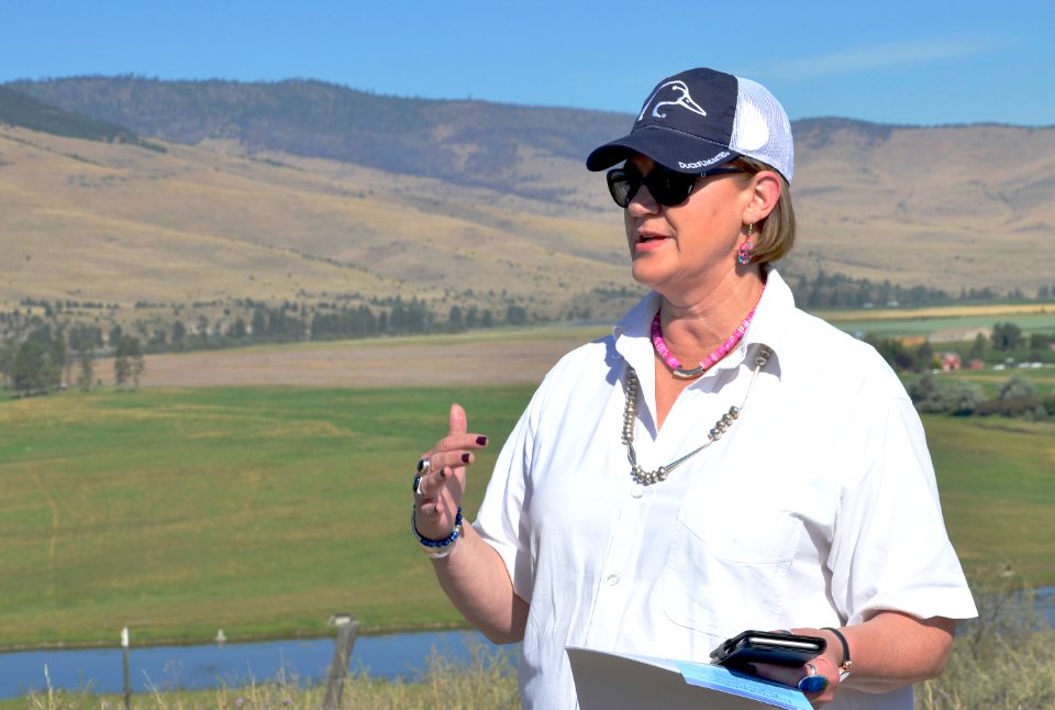 Kim Berns, NRCS Easement Programs Division Director, speaks at the Foust Wetlands Reserve Program easement celebration July 26, 2016. Lake County, Montana. Kim wears a cap presented by Ducks Unlimited, one of the partners who helped bring about this easem