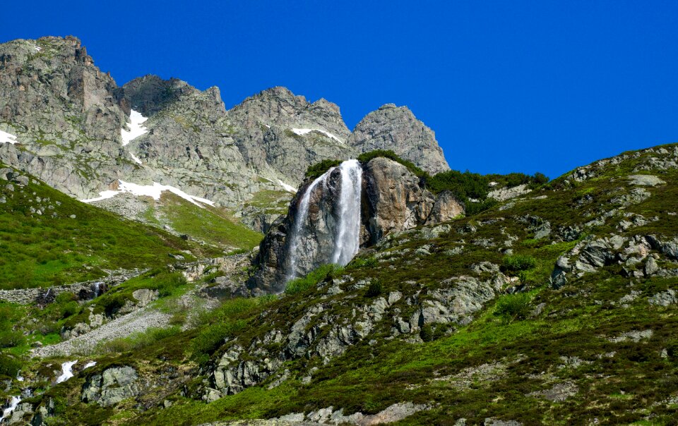 Waterfall alpine mountains