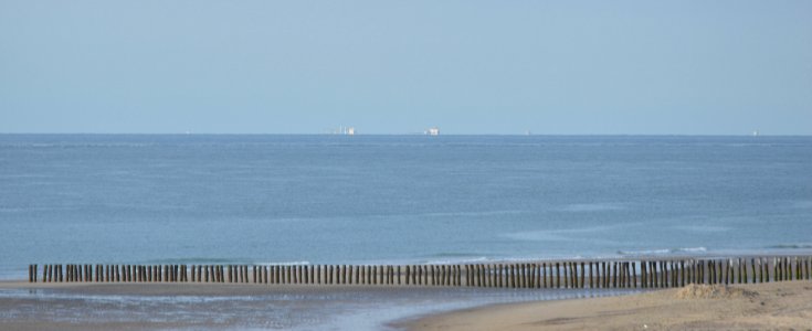 20170807 beach Burgh Haamstede, NL, view on the petrolindustry at Maasvlakte, Rotterdam photo