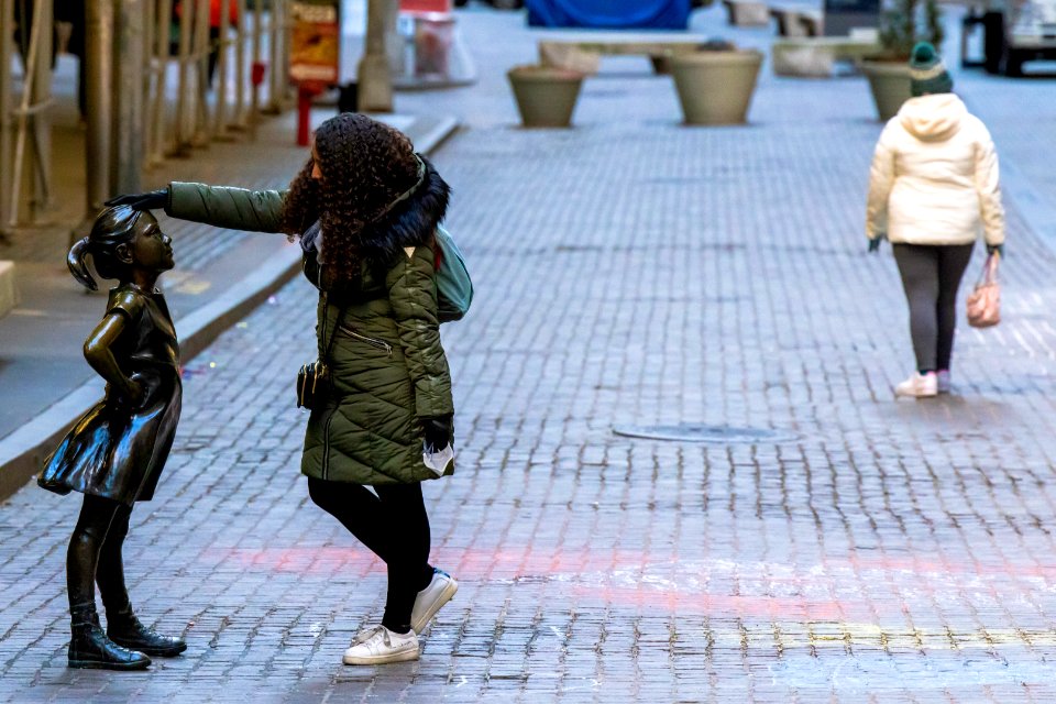 Fearless Girl and woman