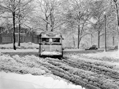 The Ice Route: A bus going through the snow near Connecticut Avenue and Chevy Chase Circle, Washington, D.C. March 1942.