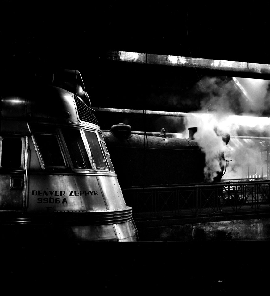 Steel Thunderbolts: A Steam and a diesel engine at the Union Station yards in Chicago, Illinois. January 1943.