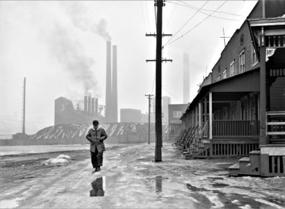 And Miles To Go: Scene in west Aliquippa, Pennsylvania. Stacks of the Jones and Laughlin Steel Corporation in background. January 1941.