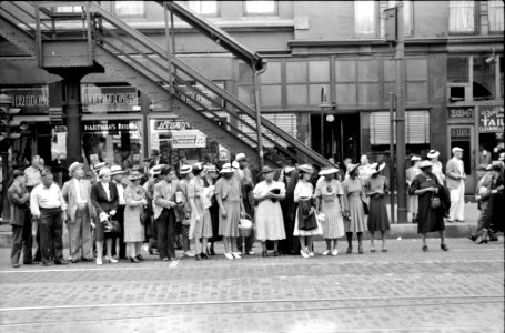 One for All: Waiting for a street car in Chicago, Illinois, 1940.