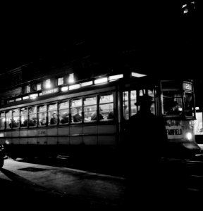 They Ride By Night: Trolley carrying workers to the night shift at the Bethlehem Fairfield shipyard. Baltimore, Maryland. April 1943