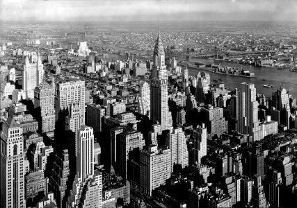 Gotham: View from Empire State Building to Chrysler Bldg. and Queensboro Bridge, low viewpoint. Jan 1932.