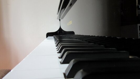 Reflection mirroring piano keyboard photo