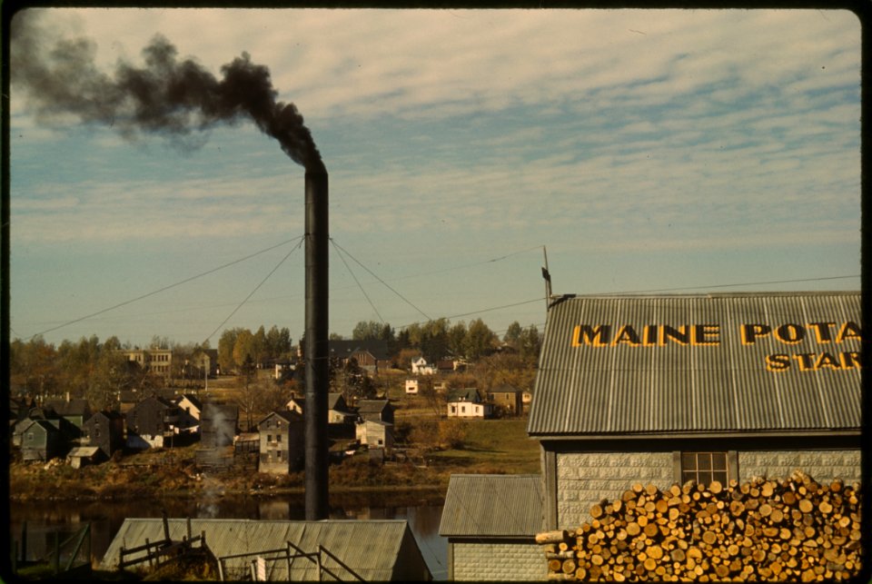 Stacks to the Sky: A starch factory along the Aroostook River, Caribou, Aroostook County, Maine. October 1940.