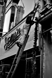 But Once a Year: Hanging Christmas decorations in Providence, Rhode Island, December 1940.