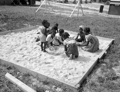 Bridgeton, New Jersey. FSA (Farm Security Administration) agricultural workers' camp. The children are discouraged from going to the fields, but told to stay around camp where they can play safely. July 1942.