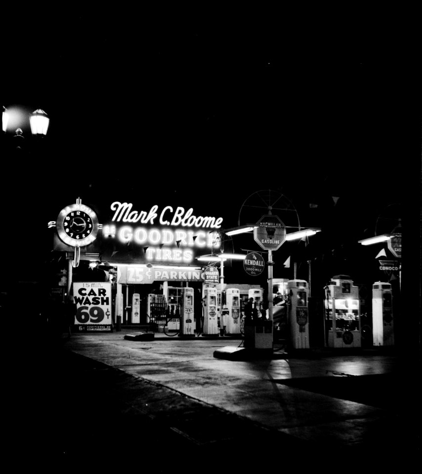Gasoline filling station at night in Hollywood, California. April 1942.