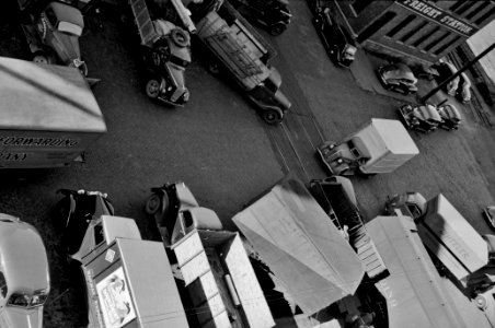 Side Ways: Trucks being loaded. Minneapolis, Minnesota, October 1939.