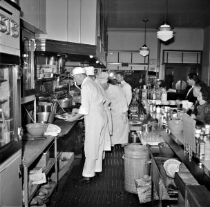 Obey Your Air Raid Warden: Scene in the Italian 'North Beach' restaurant during a blackout. San Francisco, California. December 1941.