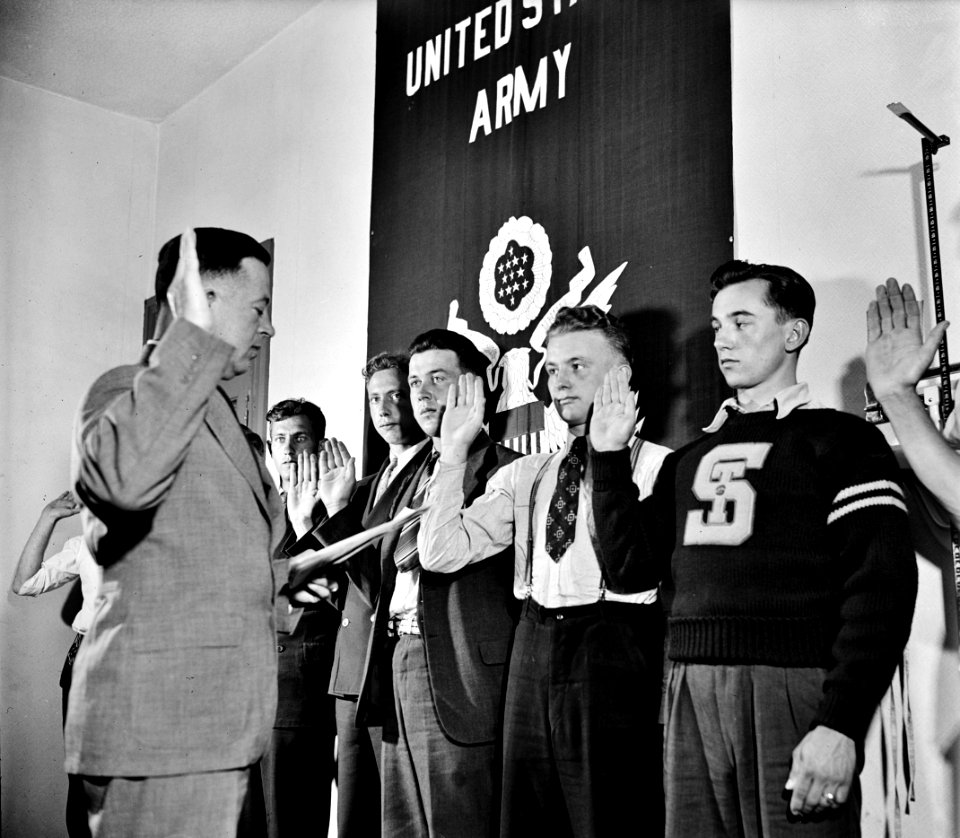 Youth in Twilight: Group of men being sworn in by Major Seth Gayle, Jr. in Washington, D.C., 1940.