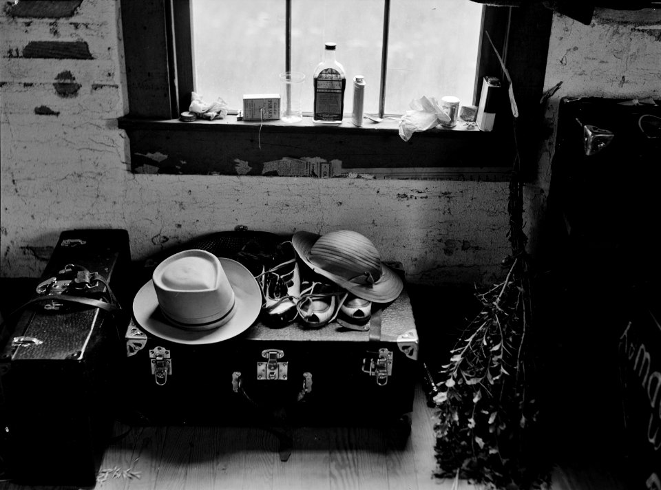 The Things They Carried: In the new home of a group of Florida migrant workers just arrived in Onley, Virginia, July 1940. photo