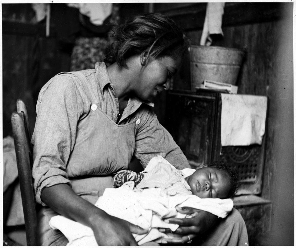 Madonna and Child: Migrant Cotton Picker with her baby. Maricopa County, Arizona, 1940.