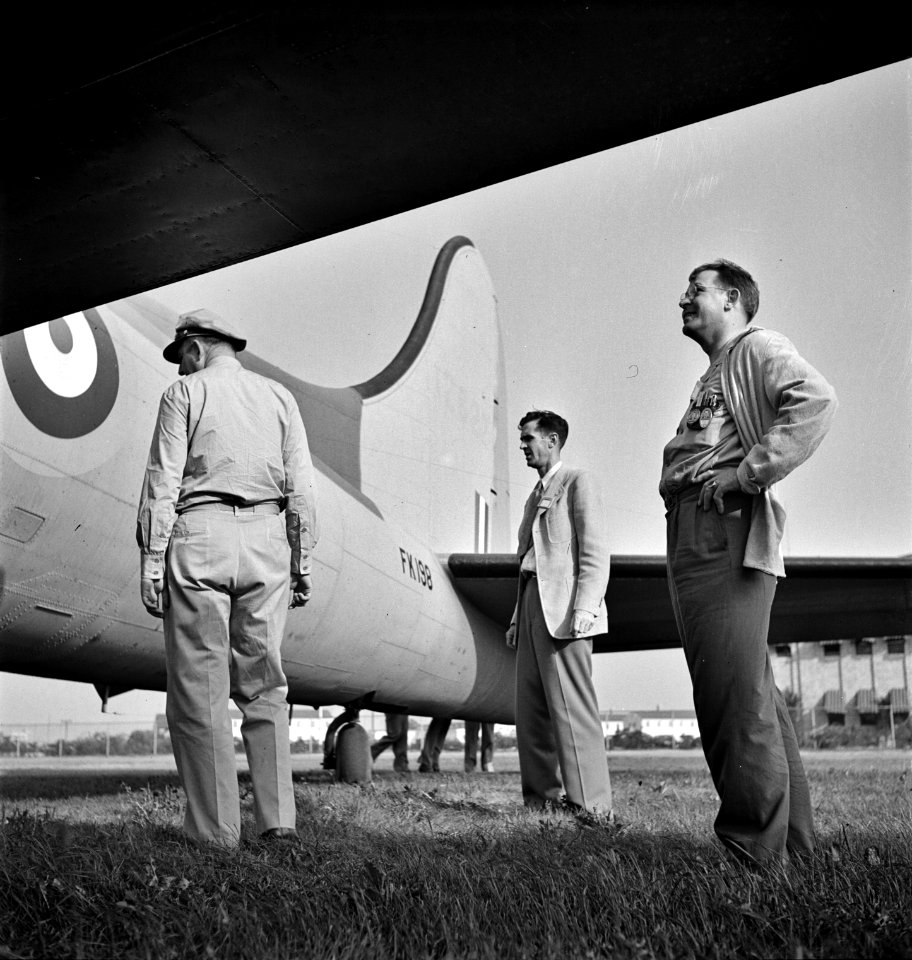 Inspectors Gadget: Workers inspecting a plane at the Wayne County Airport, a United States Army Air Corps air ferry command base sixteen miles from Detroit, Michigan. September 1942.