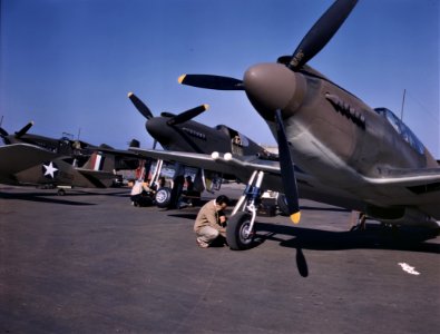 OK Corral: P-51 Mustang fighter planes being prepared for test flight at the field of North American Aviation plant in Inglewood, California. October 1942. photo