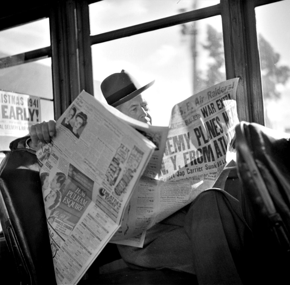 Just the Beginning: Reading war news aboard streetcar. San Francisco, California, December 1941.