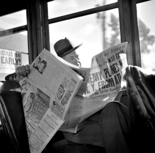 Just the Beginning: Reading war news aboard streetcar. San Francisco, California, December 1941.