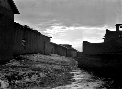 Tarde en un Pueblo: Street of a Mexican village up in the hills. Cordova, New Mexico, December 1935.