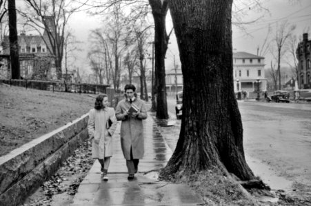 Rainy Day Chaperone: Coming home from school on a rainy day in Norwich, Connecticut, November 1940.