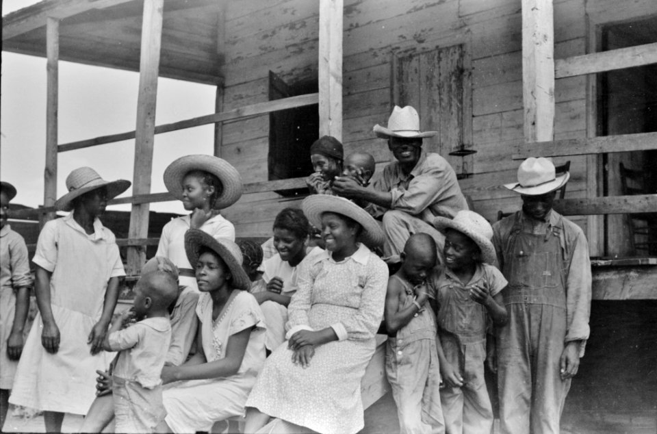 Community: Public health doctor giving a tenant family medicine for malaria, near Columbia, South Carolina, 1939.