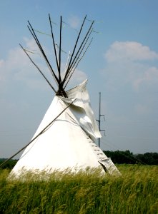 Teepee With Electric Tower in Backgrounf