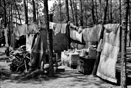 Home of one of two families who travel and work together all through the South, repairing stalls, stoves, tools, houses, and any other odd jobs. Tourist camp near Atlanta, Georgia, 1939. photo
