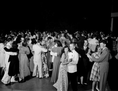 A Venetian night party at the Detroit yacht club, whose members represent the wealthier class of manufacturers and their friends. Crowd dancing, 1940.