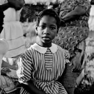 A young girl, daughter of a farmer, watching and waiting. Ridge well project. Saint Mary's County, Maryland, June 1941.