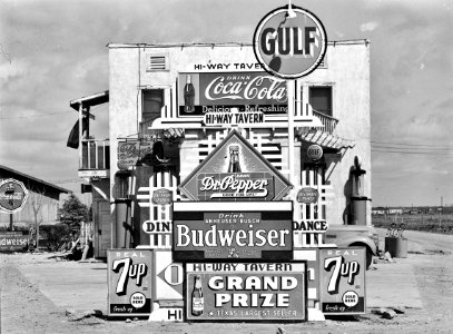 Hi-Way Tavern: Signs in front of a highway tavern. Crystal City, Texas, March 1939. photo