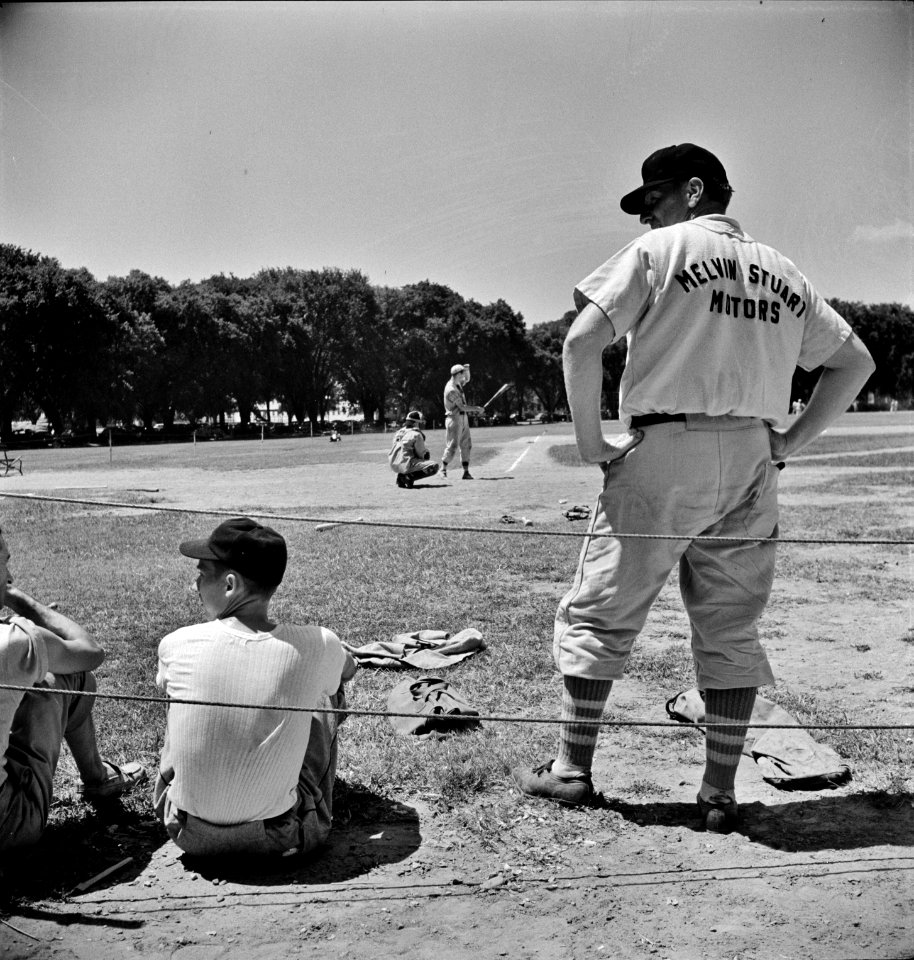 Players in an amateur baseball game between the employees' recreation association and a team recruited from garage workers. Washington, D.C. June 1942.