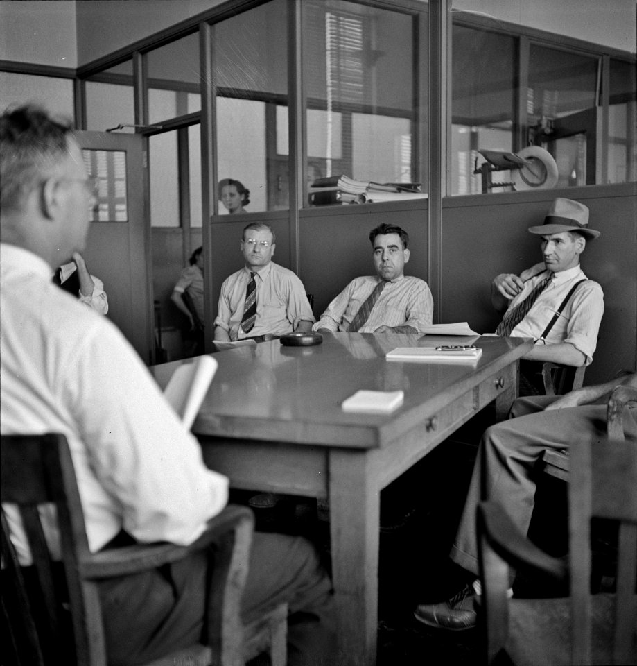 Bored Meeting: Chrysler Corporation Dodge truck plant. One of many conferences about production schedules, blueprints, etc. are required to maintain the smooth steady flow of Dodge Army trucks, 1942.