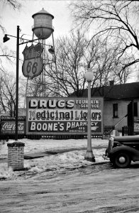 Wares of Kentland: Sign at a filling station in Kentland, Indiana. December 1937.