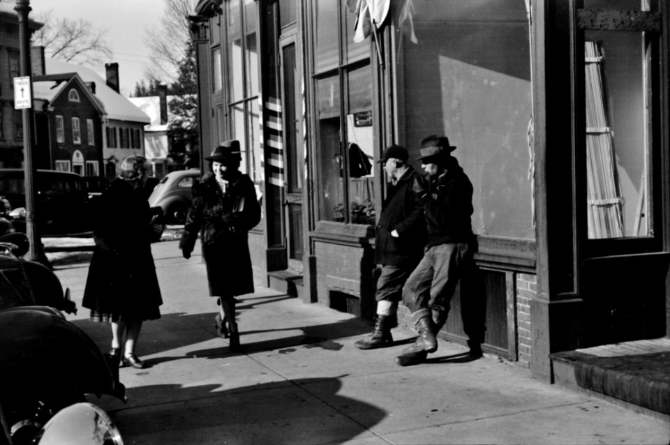 Townspeople of Woodstock, Vermont discussing the severe winter on the street corner in center of town, 1940.