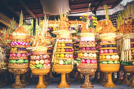 Traditional balinese offerings to Gods with fruits in basket. photo