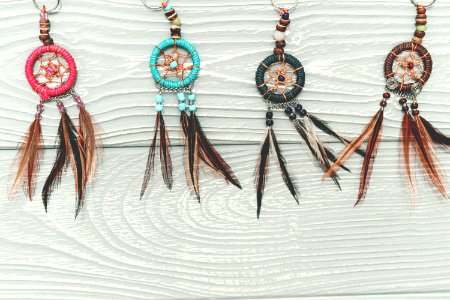 Dreamcatchers on a wooden background photo