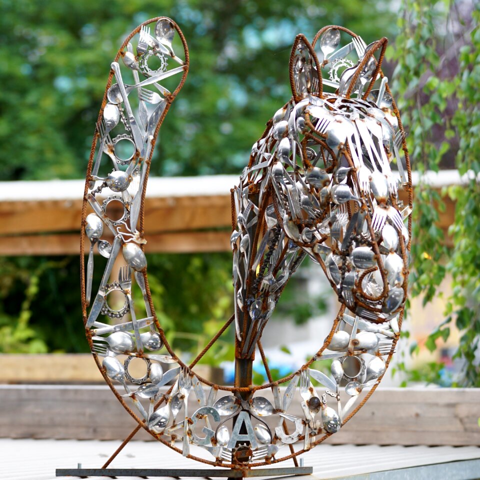 Horseshoe cutlery art