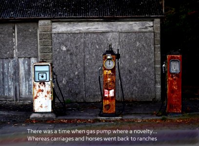 Rusting old petrol pumps photo