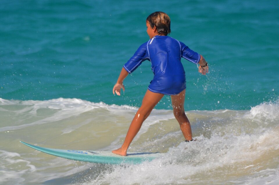 Child surfboard sports photo