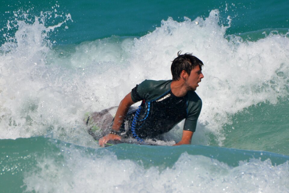 Man surfboard sports photo