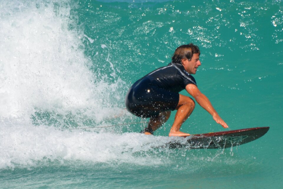 Man surfboard sports photo