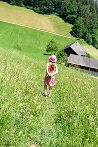 Girl meadow downhill photo