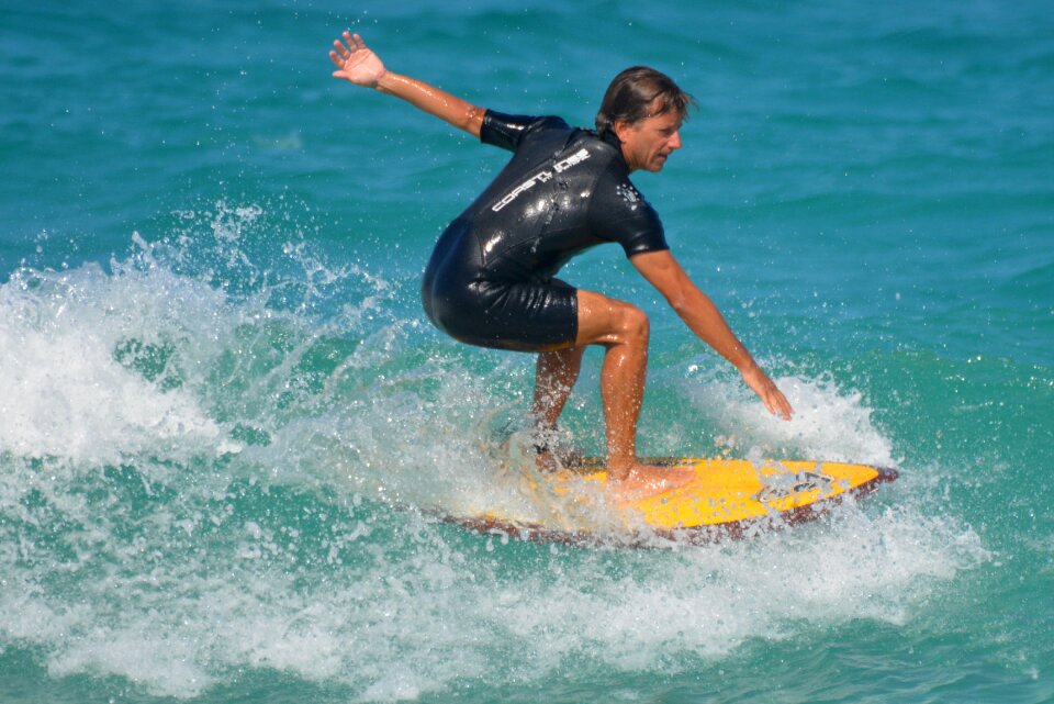 Man surfboard sports photo