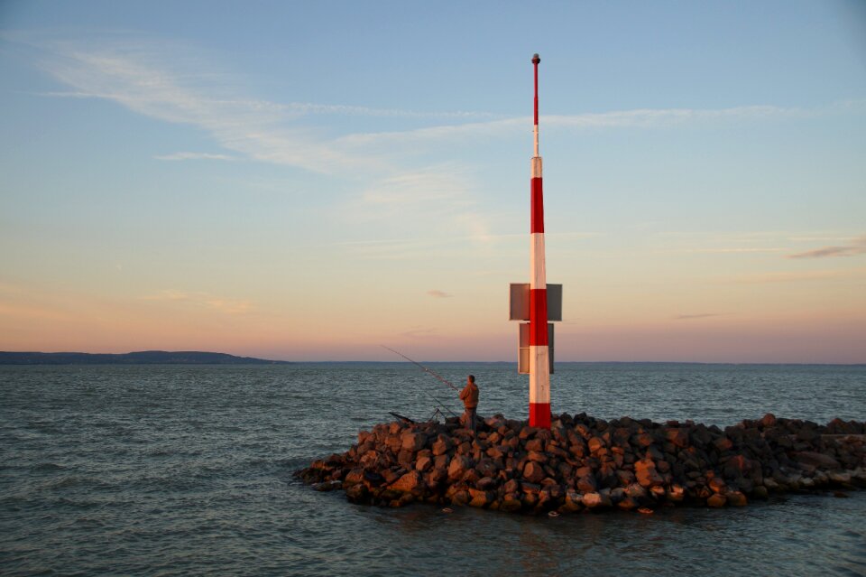 Fisherman lighthouse fish