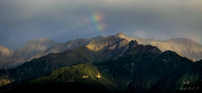 Rainbow over the mountain photo