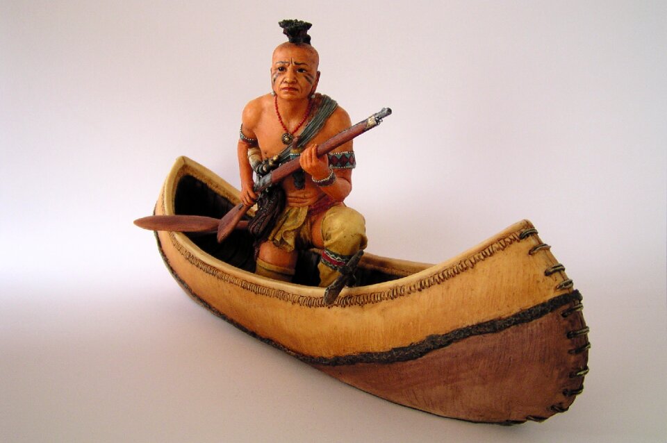 Figure indians canoeing